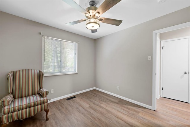5 Braquewood Ct, Manchester, MO 63021 - living area with wood finished floors, baseboards, and ceiling fan