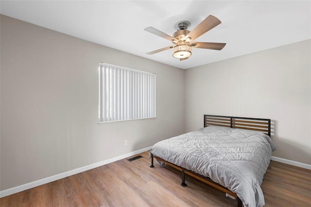 5 Braquewood Ct, Manchester, MO 63021 - bedroom with baseboards, wood finished floors, and a ceiling fan