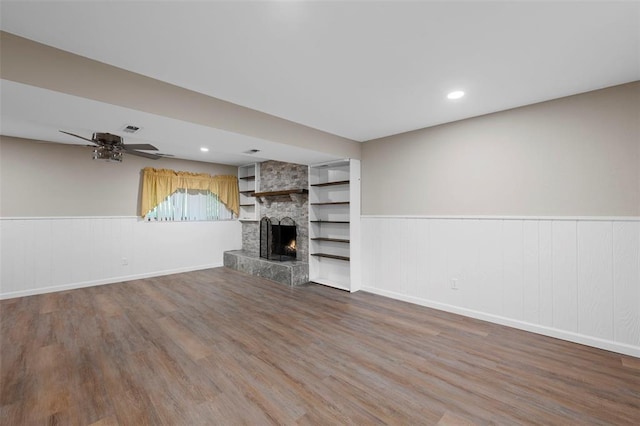 5 Braquewood Ct, Manchester, MO 63021 - unfurnished living room featuring wood finished floors, a wainscoted wall, a fireplace, ceiling fan, and recessed lighting