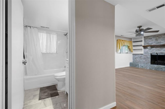 5 Braquewood Ct, Manchester, MO 63021 - bathroom with shower / bath combination with curtain, toilet, ceiling fan, a fireplace, and baseboards