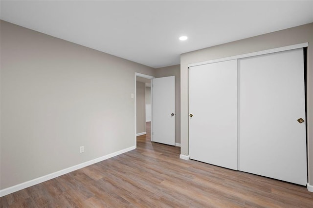 5 Braquewood Ct, Manchester, MO 63021 - unfurnished bedroom featuring recessed lighting, wood finished floors, baseboards, and a closet