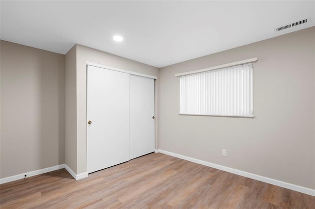 5 Braquewood Ct, Manchester, MO 63021 - unfurnished bedroom featuring baseboards, light wood finished floors, a closet, and recessed lighting