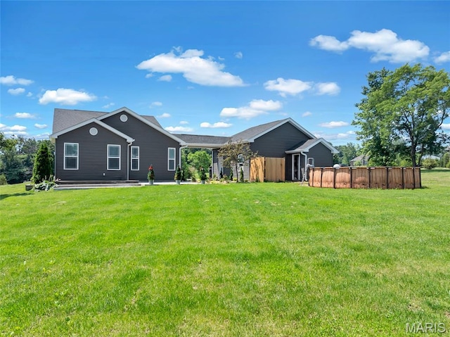 125 Foxwoods Ct, Troy, MO 63379 - rear view of house featuring a lawn