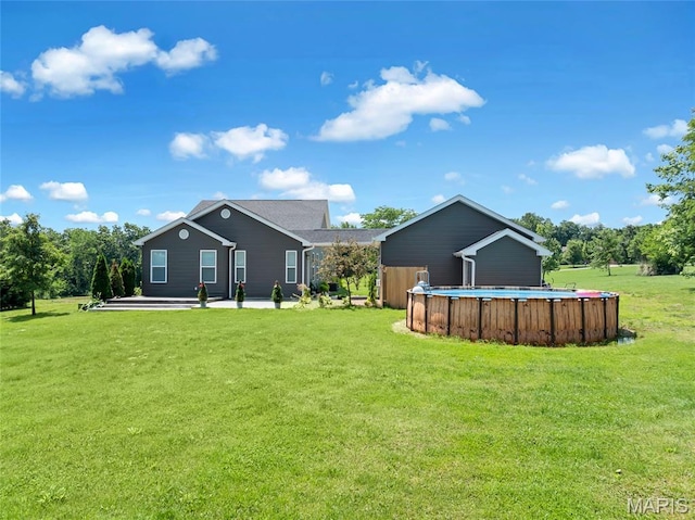 125 Foxwoods Ct, Troy, MO 63379 - view of grassy yard with an outdoor pool and a patio