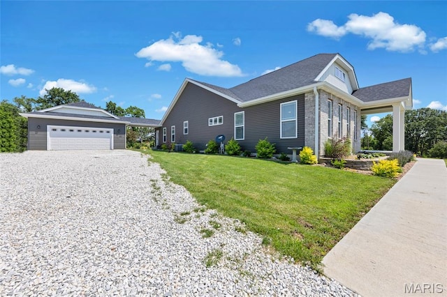 125 Foxwoods Ct, Troy, MO 63379 - view of side of home featuring a yard, roof with shingles, and gravel driveway