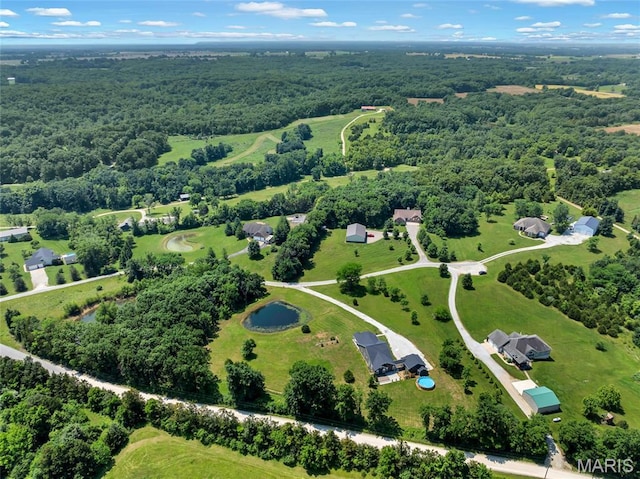 125 Foxwoods Ct, Troy, MO 63379 - aerial view of property and surrounding area featuring a heavily wooded area