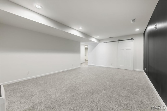 125 Foxwoods Ct, Troy, MO 63379 - finished basement with recessed lighting, a barn door, and carpet