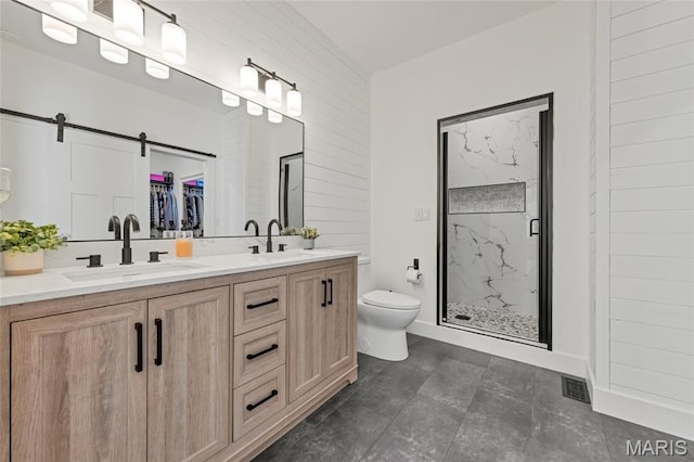 125 Foxwoods Ct, Troy, MO 63379 - bathroom featuring a marble finish shower, double vanity, and a walk in closet