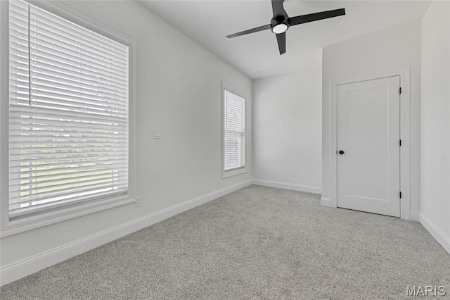 125 Foxwoods Ct, Troy, MO 63379 - unfurnished bedroom with carpet flooring, multiple windows, and a ceiling fan