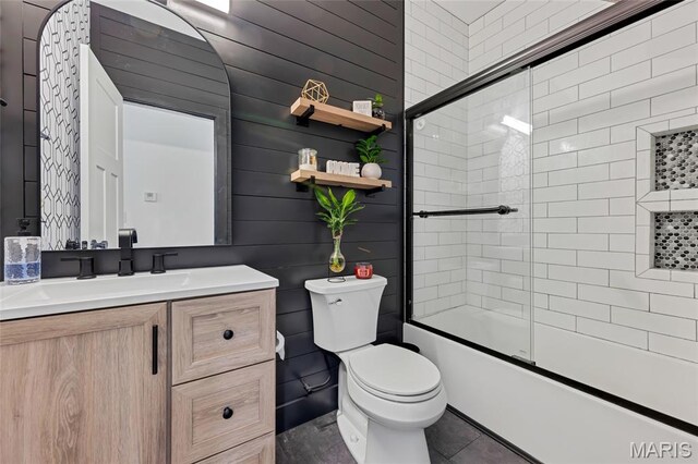 125 Foxwoods Ct, Troy, MO 63379 - bathroom featuring vanity, bath / shower combo with glass door, and tile patterned flooring