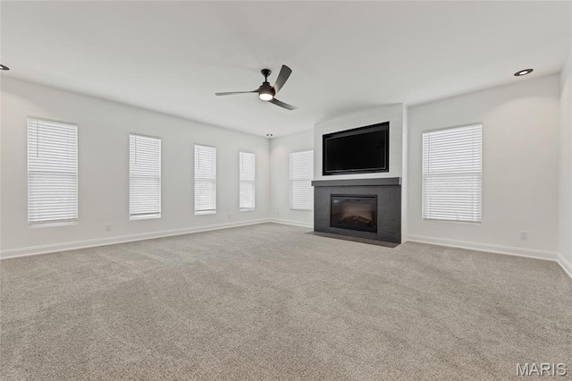 125 Foxwoods Ct, Troy, MO 63379 - unfurnished living room with ceiling fan, a fireplace, and carpet