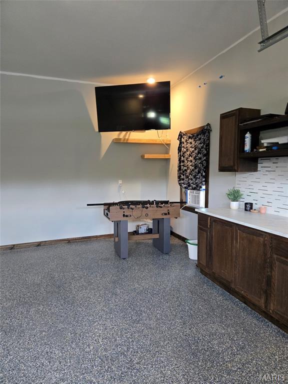 125 Foxwoods Ct, Troy, MO 63379 - rec room with baseboards and light speckled floor