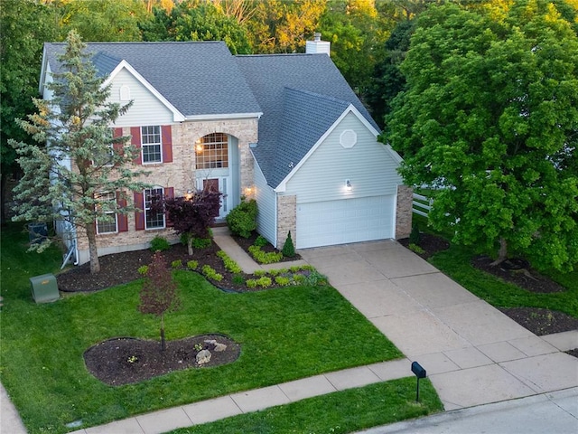 3226 Bridgeport Place Dr, Bridgeton, MO 63044 - traditional-style home featuring concrete driveway, a front lawn, an attached garage, roof with shingles, and a chimney