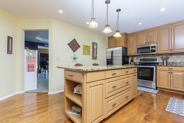 3226 Bridgeport Place Dr, Bridgeton, MO 63044 - kitchen with appliances with stainless steel finishes, open shelves, light wood-style flooring, light stone countertops, and decorative light fixtures