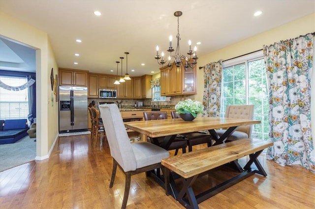 3226 Bridgeport Place Dr, Bridgeton, MO 63044 - dining space with a chandelier, light wood-style flooring, recessed lighting, and baseboards