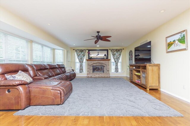 3226 Bridgeport Place Dr, Bridgeton, MO 63044 - living room featuring a ceiling fan, baseboards, wood finished floors, a fireplace, and recessed lighting