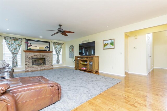 3226 Bridgeport Place Dr, Bridgeton, MO 63044 - living room featuring ceiling fan, wood finished floors, baseboards, a fireplace, and recessed lighting
