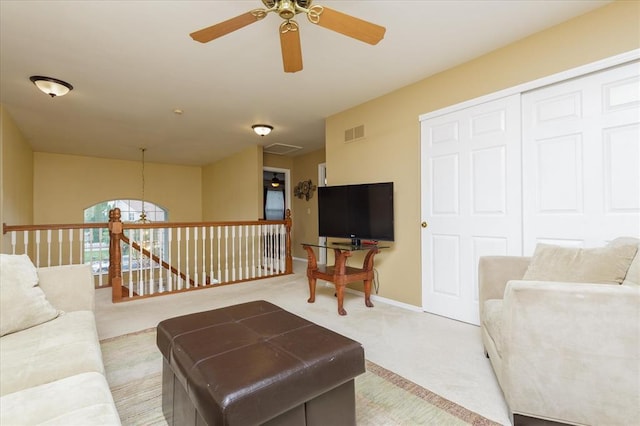3226 Bridgeport Place Dr, Bridgeton, MO 63044 - living area with light carpet, a ceiling fan, and baseboards