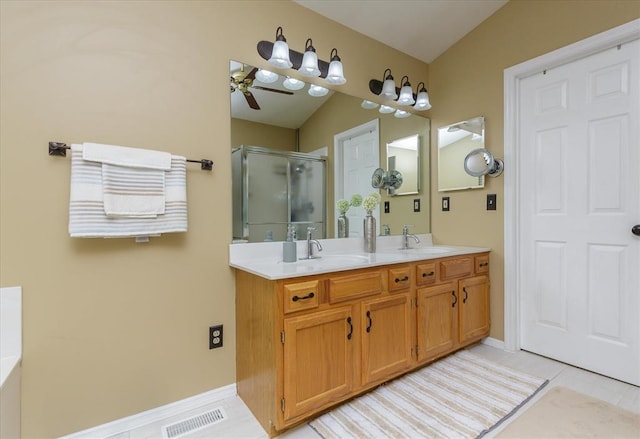 3226 Bridgeport Place Dr, Bridgeton, MO 63044 - full bathroom with a shower stall, ceiling fan, double vanity, tile patterned floors, and baseboards