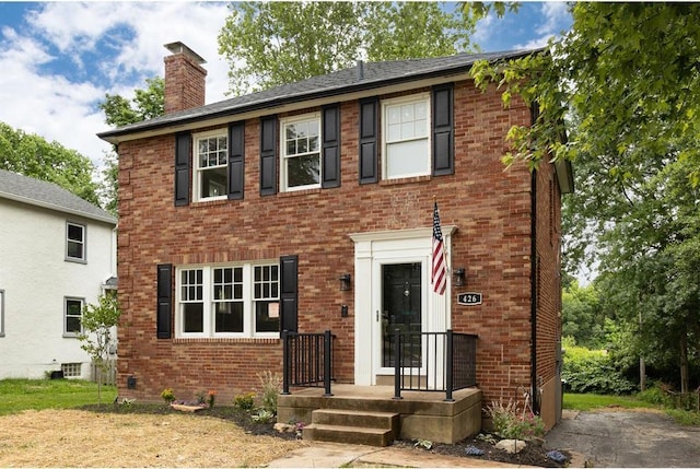 426 Pasadena Ave, Webster Groves, MO 63119 - view of front of home featuring brick siding and a chimney