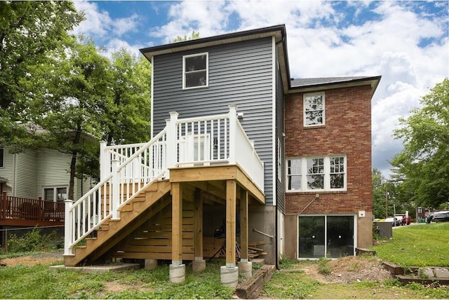 426 Pasadena Ave, Webster Groves, MO 63119 - rear view of property with stairway, brick siding, and a wooden deck