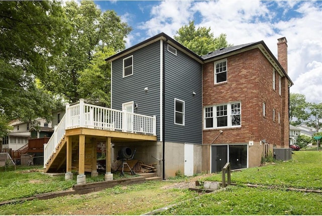 426 Pasadena Ave, Webster Groves, MO 63119 - back of property featuring a deck, stairway, a yard, a chimney, and central AC