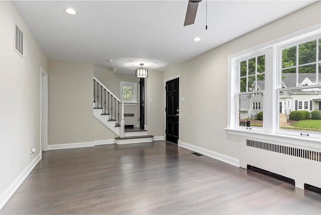 426 Pasadena Ave, Webster Groves, MO 63119 - entrance foyer featuring radiator, wood finished floors, recessed lighting, baseboards, and stairs