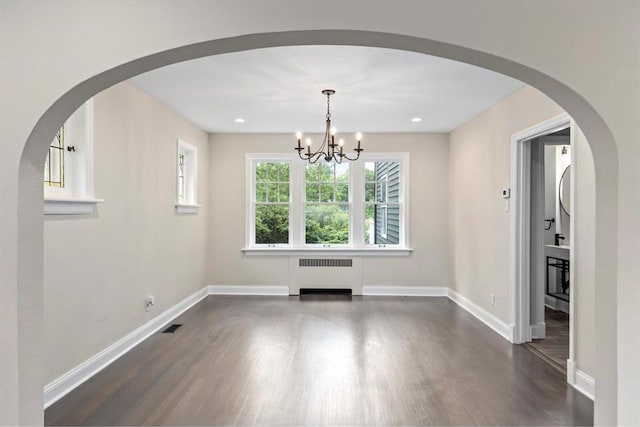 426 Pasadena Ave, Webster Groves, MO 63119 - unfurnished dining area featuring radiator heating unit, dark wood-style floors, a chandelier, and baseboards