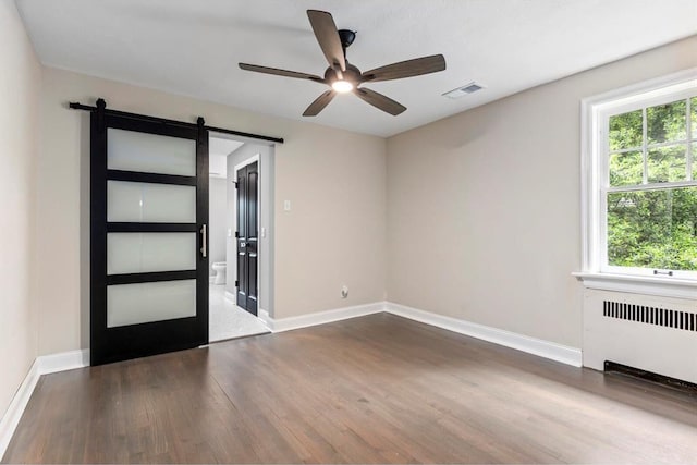 426 Pasadena Ave, Webster Groves, MO 63119 - empty room with radiator heating unit, wood finished floors, ceiling fan, and baseboards