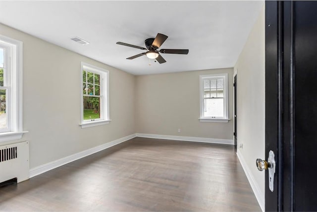 426 Pasadena Ave, Webster Groves, MO 63119 - empty room with ceiling fan, wood finished floors, baseboards, and radiator