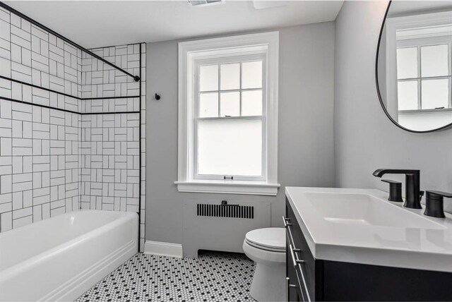 426 Pasadena Ave, Webster Groves, MO 63119 - bathroom featuring radiator, vanity, toilet, shower / washtub combination, and baseboards