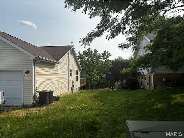 7764 Locust Dr, Barnhart, MO 63012 - view of side of home with a lawn and roof with shingles