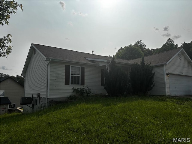 7764 Locust Dr, Barnhart, MO 63012 - view of front of property with an attached garage and a front yard