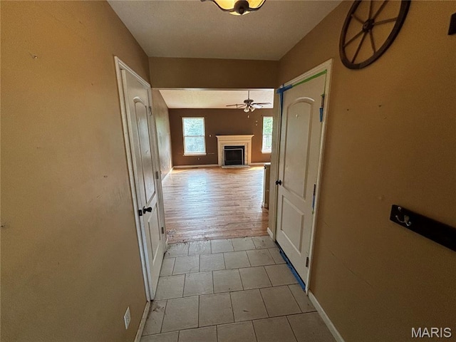 7764 Locust Dr, Barnhart, MO 63012 - hallway featuring baseboards and tile patterned floors
