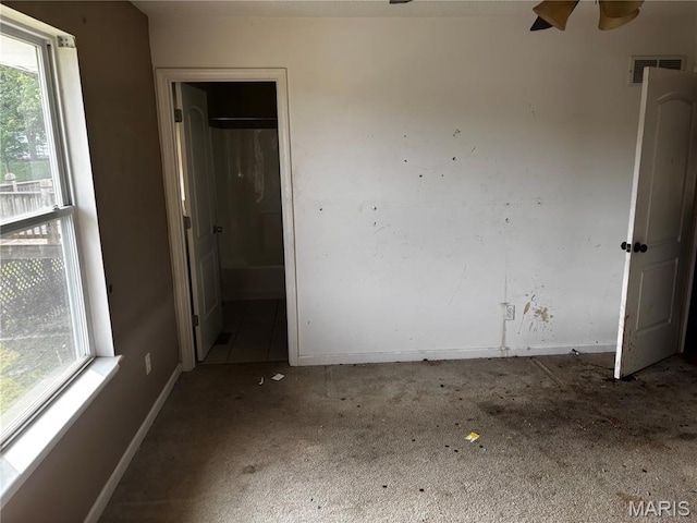 7764 Locust Dr, Barnhart, MO 63012 - unfurnished room featuring a ceiling fan, baseboards, and carpet