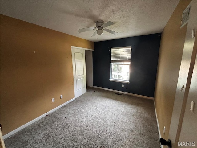 7764 Locust Dr, Barnhart, MO 63012 - carpeted spare room featuring ceiling fan, a textured ceiling, and baseboards