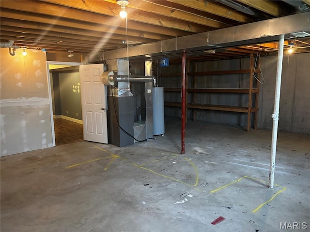 7764 Locust Dr, Barnhart, MO 63012 - unfinished below grade area featuring water heater and heating unit
