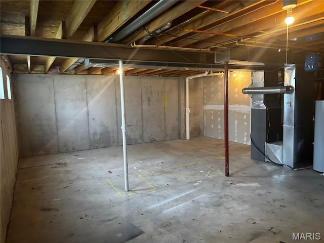 7764 Locust Dr, Barnhart, MO 63012 - unfinished basement featuring water heater and heating unit