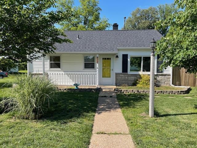 212 E N St, Benton, MO 63736 - bungalow-style house featuring a shingled roof, a porch, and a chimney