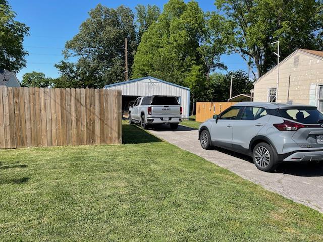 212 E N St, Benton, MO 63736 - view of yard with a detached garage