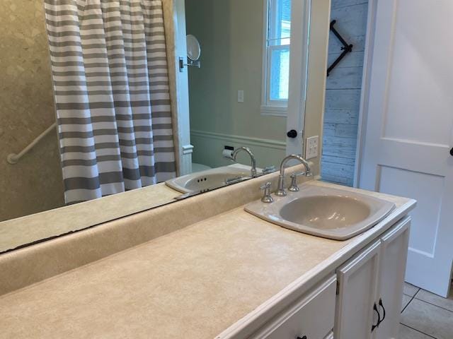 212 E N St, Benton, MO 63736 - bathroom featuring vanity, toilet, tile patterned floors, and a shower with curtain