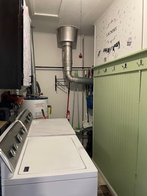 212 E N St, Benton, MO 63736 - laundry room with washer and clothes dryer, water heater, and ornamental molding