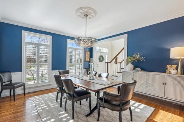 884 Craig Forest Ln, Saint Louis, MO 63122 - dining room with a chandelier, crown molding, stairway, wood finished floors, and wainscoting
