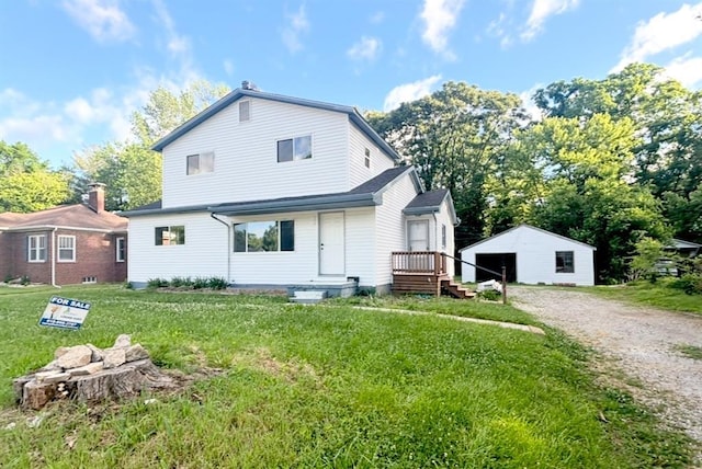 6005 N Belt W, Belleville, IL 62223 - back of property featuring an outdoor structure, a lawn, and a detached garage
