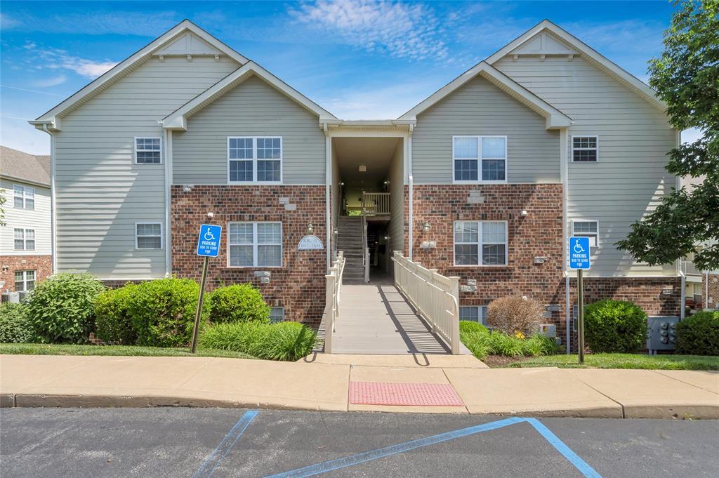 1634 Piedmont Cir, Saint Peters, MO 63304 - view of building exterior featuring uncovered parking