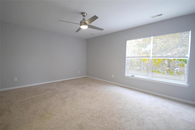 2922 Pennsylvania Ave, Saint Louis, MO 63118 - unfurnished room featuring a ceiling fan, light carpet, and baseboards