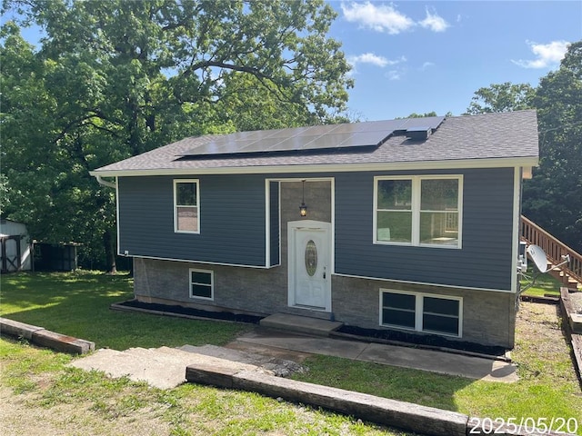 13083 Hencher Rd, De Soto, MO 63020 - bi-level home with a front lawn, solar panels, and a shingled roof