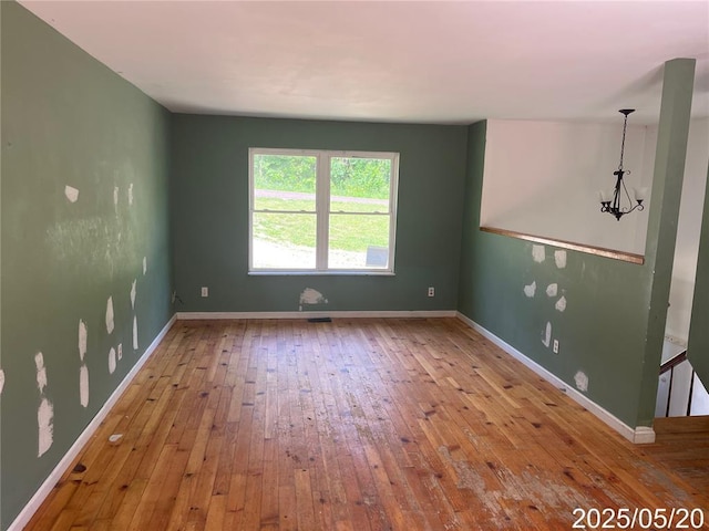 13083 Hencher Rd, De Soto, MO 63020 - unfurnished room featuring hardwood / wood-style floors and baseboards