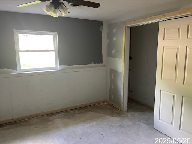 13083 Hencher Rd, De Soto, MO 63020 - empty room with a ceiling fan and unfinished concrete floors