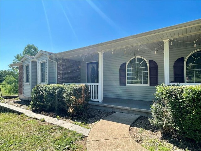 17250 Brewster Ln, Crocker, MO 65452 - property entrance with a porch